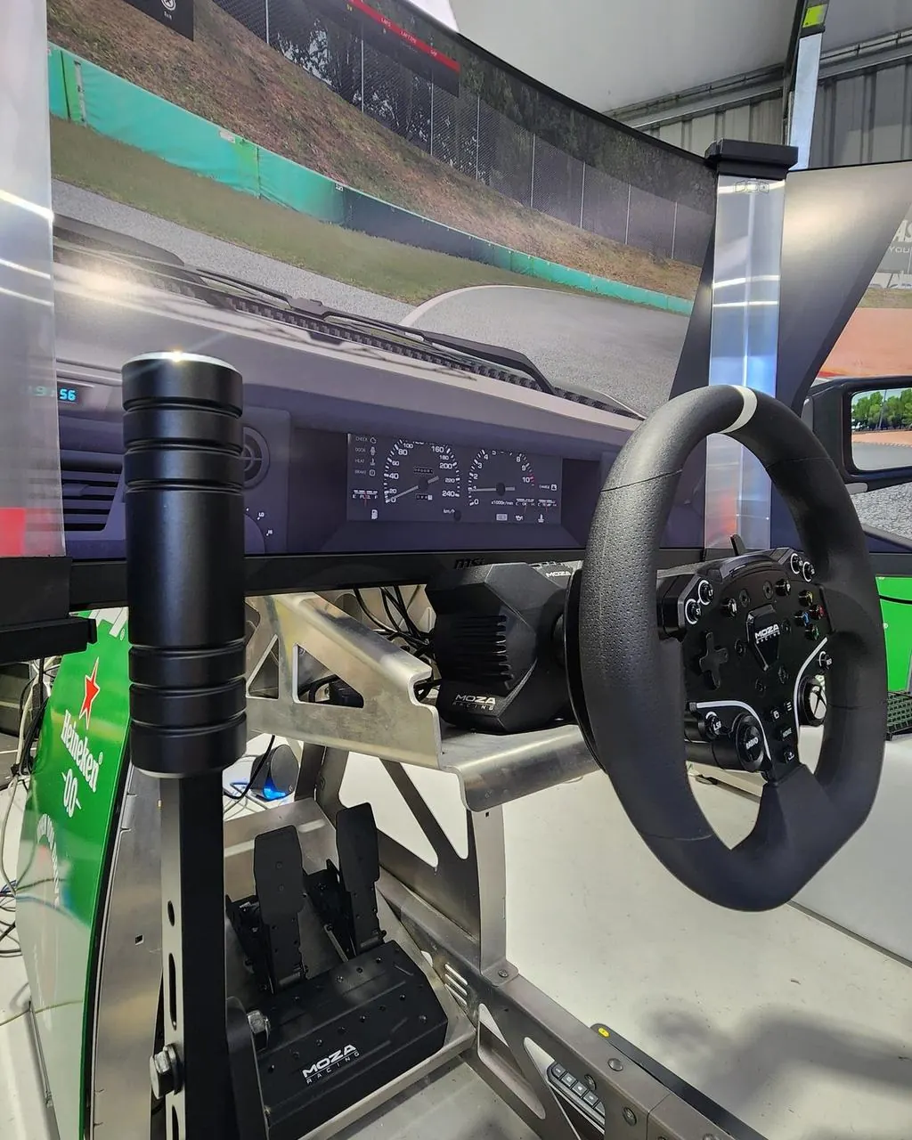 MOZA direct drive wheel, handbrake and pedals mounted on a Racetech sim rig chassis