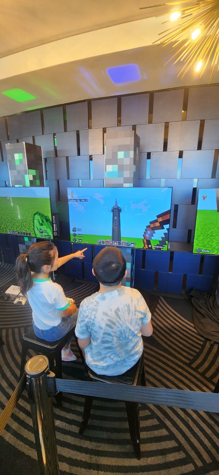 Kids exploring an in-game Minecraft build of the Sky Tower itself, part of the Pixel Overworld activation