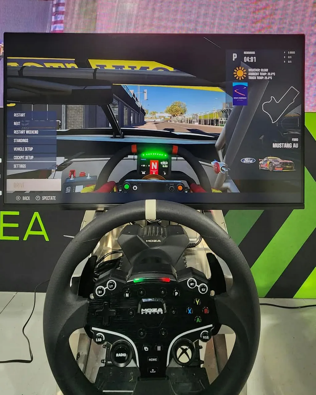 In-car cockpit view at Mount Panorama on the TCL 32G64, behind a MOZA Xbox wheel on a Ping Zero sim rig